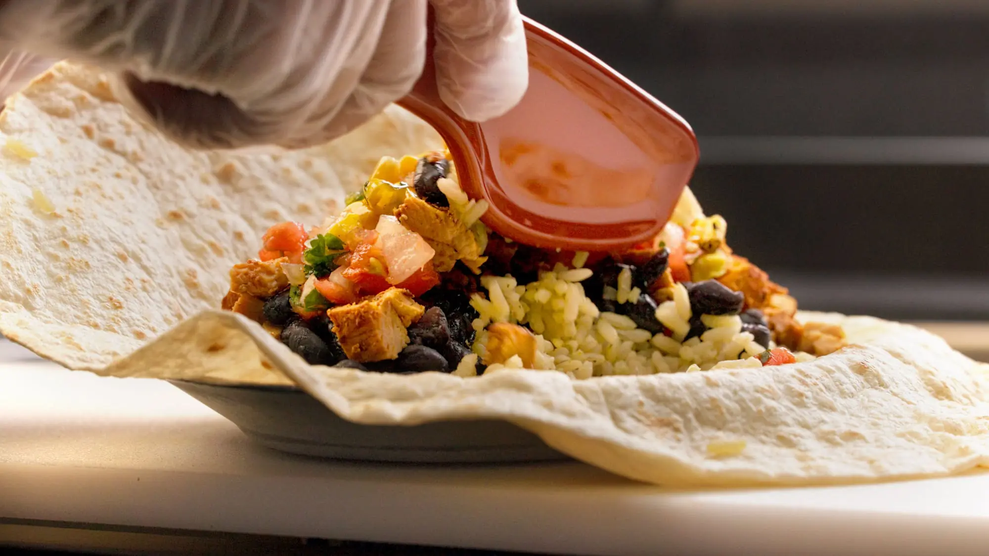 Bob the Tool mixing Pancheros burrito ingredients