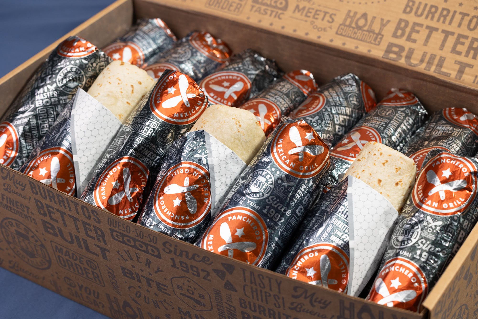 Wrapped Pancheros burritos in a catering box