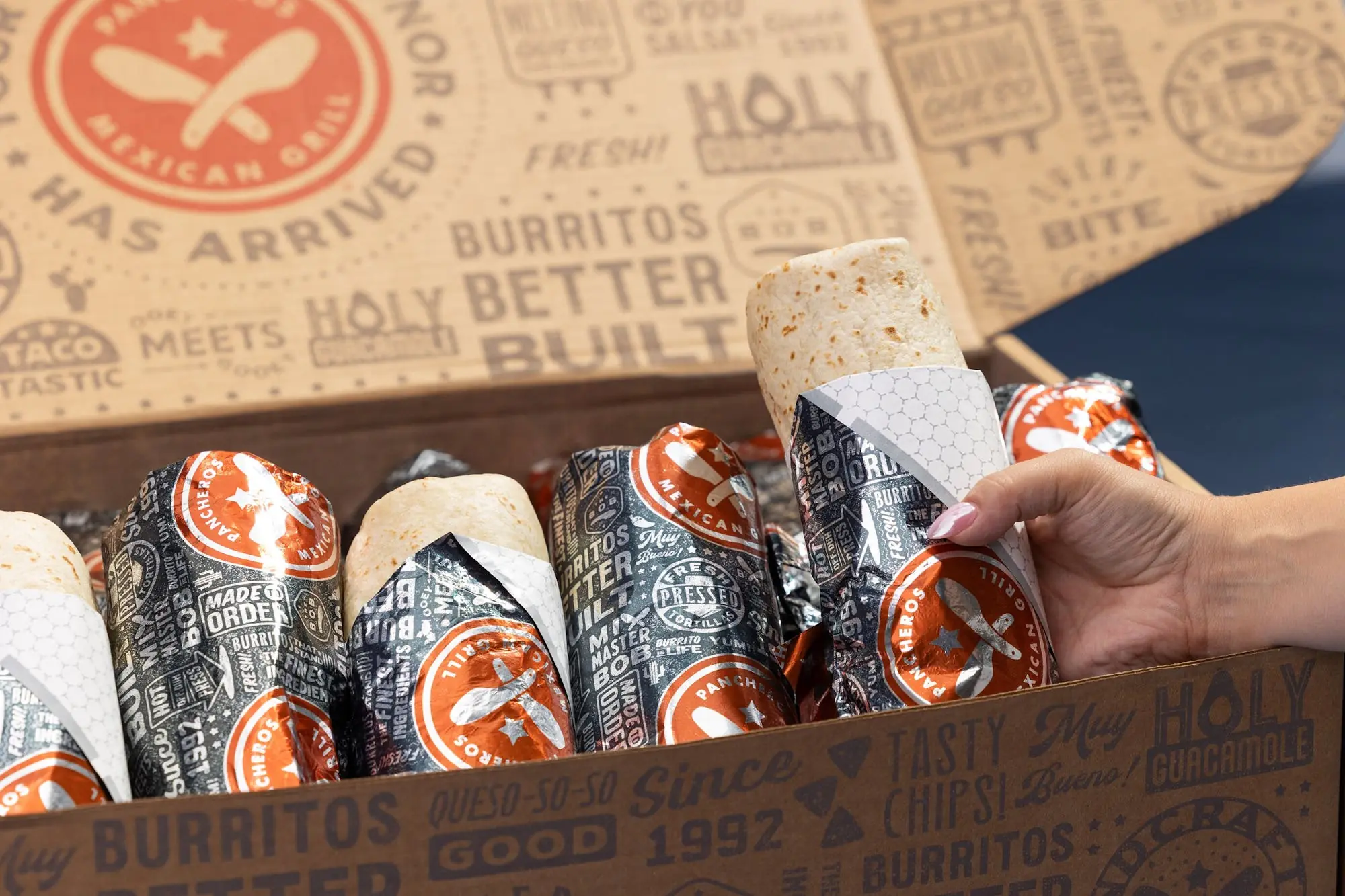 Wrapped Pancheros burritos in a catering box