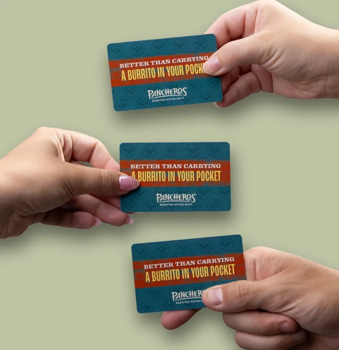Hands holding Pancheros gift cards